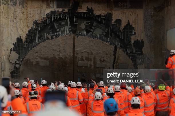 Construction workers and members of the media view tunnel boring machine "Cecelia" breaking through, after tunnelling under the Chiltern Hills at the...