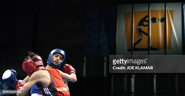Amir Khan of Great Britain exchanges blows with Serik Yeleuov of Kazakhstan during their lightweight Olympic Games semi-final boxing match at the...