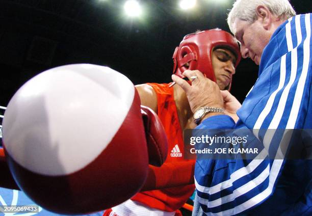 Amir Khan of Great Britain has his helmet removed following his first round victory over Jong Sub Baik of Korea in their lightweight quarter-final...