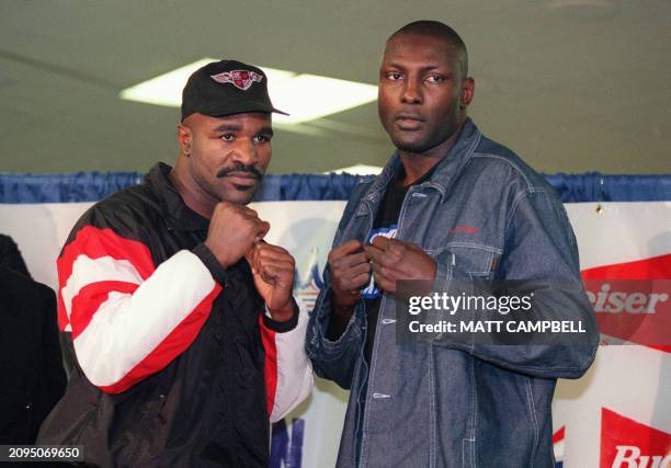 Boxers Evander Holyfield of the US and Henry Akinwande of England pose for photographers during a press conference at Madison Square Garden 02 June...