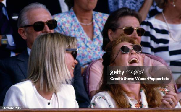 Sarah, Duchess of York attends the Wimbledon Lawn Tennis Championships with Carolyn Beckwith-Smith at the All England Lawn Tennis and Croquet Club in...
