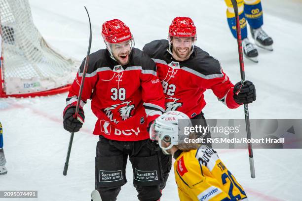 Lukas Frick of Lausanne HC celebrates his goal with teammates during the Swiss National League Play Offs game between Lausanne HC and HC Davos at...