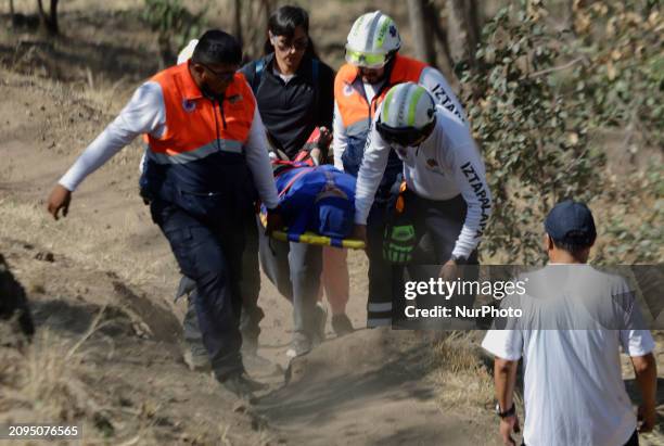 Members of Civil Protection are rescuing a person who suffered a fall while climbing Cerro de la Estrella in the Iztapalapa mayor's office in Mexico...