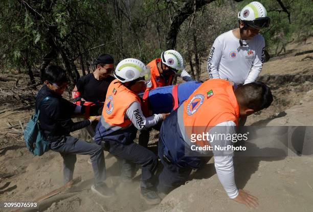 Members of Civil Protection are rescuing a person who suffered a fall while climbing Cerro de la Estrella in the Iztapalapa mayor's office in Mexico...