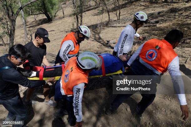 Members of Civil Protection are rescuing a person who suffered a fall while climbing Cerro de la Estrella in the Iztapalapa mayor's office in Mexico...