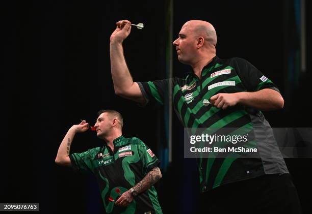 Dublin , Ireland - 21 March 2024; Rob Cross, right, and Nathan Aspinall in action during their match at the BetMGM Premier League Darts at the 3Arena...