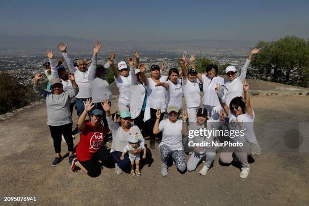 Group of people is visiting the archaeological site of Cerro de la Estrella in Mexico City, where they are performing various rituals, meditating,...