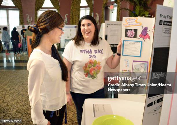 Director of the Collegiate Science and Technology Entry Program , Dr. Lorena Harris, left, looks over student Gabrielle Galluzzo of Coeymans Hollow's...