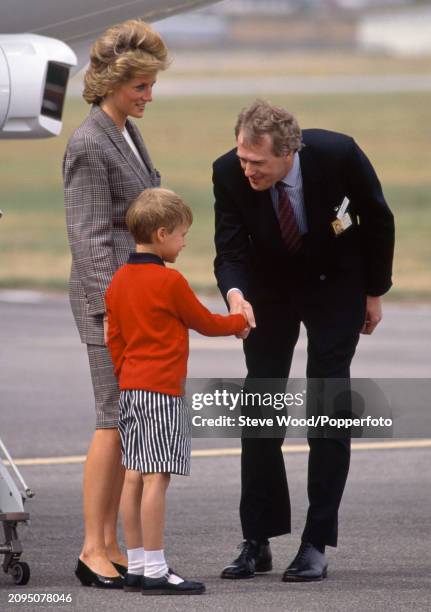 Princess Diana with her son Prince William arriving on the Royal Flight for a holiday at Balmoral near Aberdeen, Scotland on 14th August, 1989.