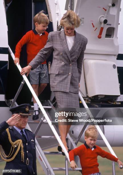 Princess Diana with her sons Prince Harry and Prince William arriving on the Royal Flight for a holiday at Balmoral in Aberdeen, Scotland on 14th...
