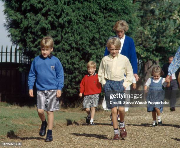 Princess Diana with her sons Prince William and Prince Harry and her nephew Alexander Fellowes walking to the wedding rehearsal of Diana's brother...