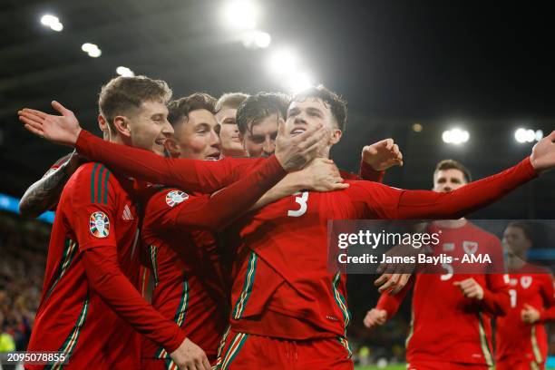 Neco Williams of Wales celebrates after scoring a goal to make it 2-0 during the UEFA EURO 2024 Play-Offs Semi-final between Wales and Finland at...