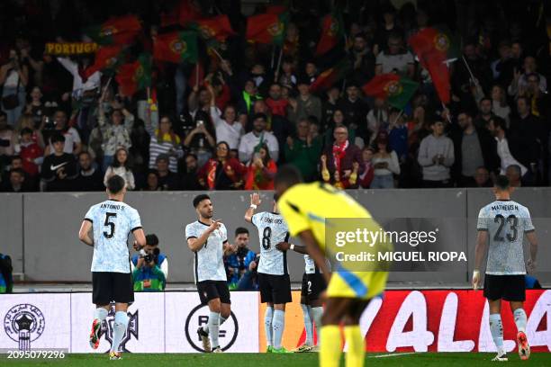 Portugal's forward Goncalo Ramos celebrates scoring his team's fifth goal during the international friendly football match between Portugal and...