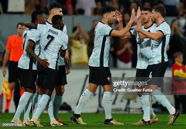 Goncalo Ramos of Portugal celebrates with teammates after scoring a goal during the International Friendly match between Portugal and Sweden at...