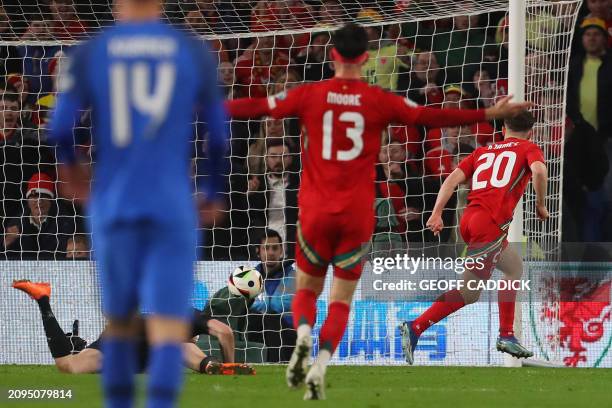 Wales' midfielder Daniel James scores their fourth goal during the UEFA Euro 2024 playoff semi-final football match between Wales and Finland, at...