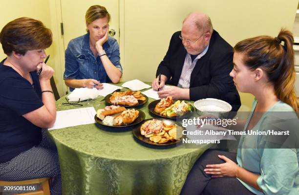 Judges at the Times Union conduct a comparison tasting of lobster rolls from four local restaurants Wednesday August 1, 2018 in Colonie, NY.