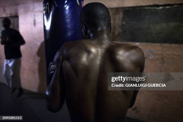 Young boxer trains in a dismissed apartheid era hostel turned gym in Kwanobuhle Township in Uitenhage on September 20, 2010 on the outskirts of Port...