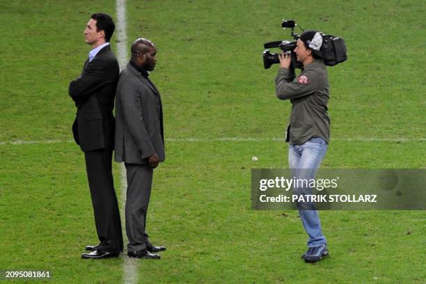 Wladimir Klitschko of Ukraine and Jean-Marc Mormeck of France are in the focus of a cameraman as they pose during a press conference at the...