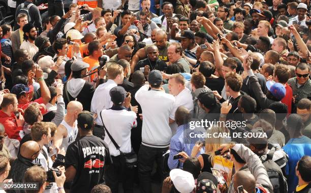 Boxer Floyd Mayweather is mobbed by fans as he arrives for a promotional training session and media opportunity at the Peacock boxing gym, Canning...