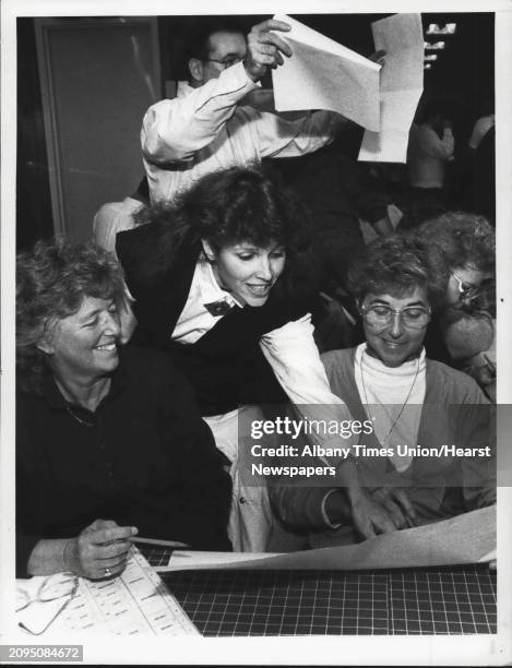 County Republican Headquarters, Shoppers Park, Colonie, New York - Clerk Candi Monica Bell smiles over tally sheets with volunteers Dorris Morrison,...
