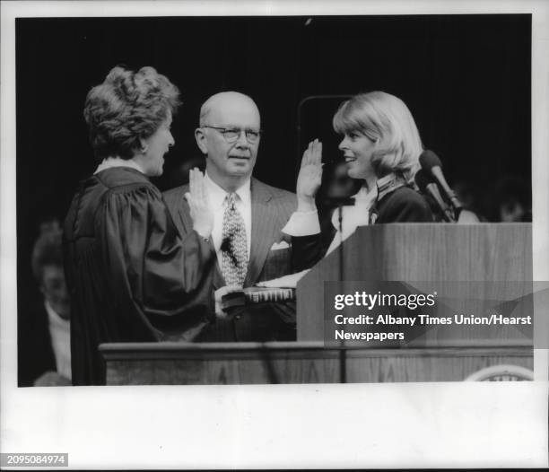 George Pataki Inaugural, Knick Arena, Albany, New York - Justice Judith Kaye swears in Lieutenant Governor Betsy McCaughey as an unidentified person...