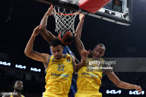 Salih Altuntas of Anadolu Efes in action against Louis Olinde and Johannes Thiemann of Alba Berlin during the Turkish Airlines EuroLeague week 31...