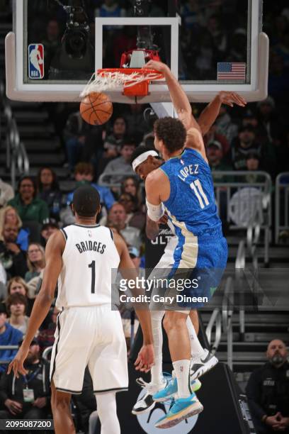 Brook Lopez of the Milwaukee Bucks dunks the ball during the game against the Brooklyn Nets on March 21, 2024 at the Fiserv Forum Center in...