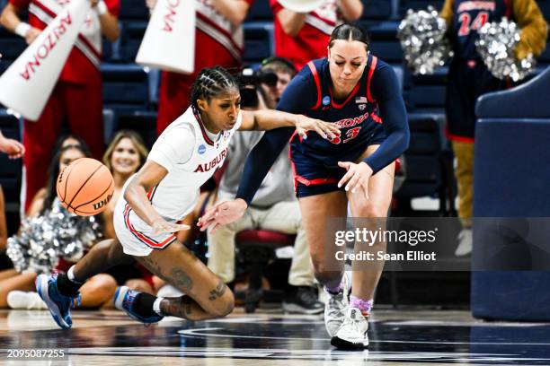 Kaitlyn Duhon of the Auburn University Tigers and Isis Beh of the University of Arizona Wildcats battle for a loose ball during the First Four round...