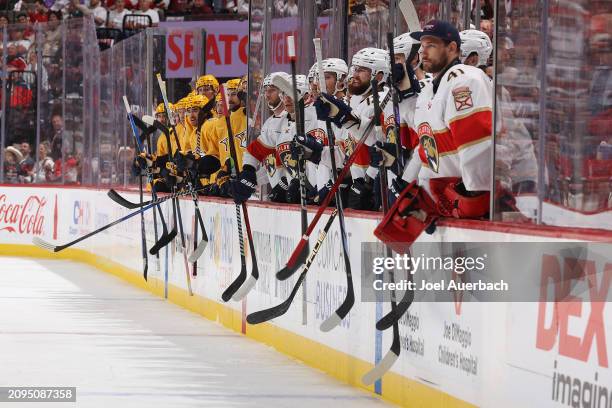 Both teams' benches bang their sticks against the boards after a fight between Jason Zucker of the Nashville Predators and Nick Cousins of the...