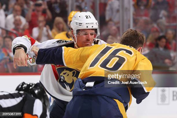 Jason Zucker of the Nashville Predators and Nick Cousins of the Florida Panthers fight in the first period at the Amerant Bank Arena on March 21,...