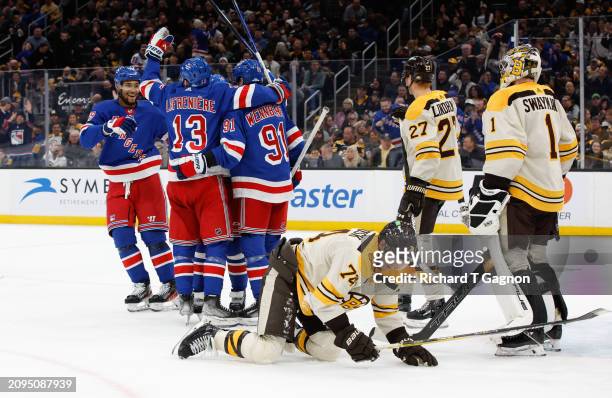 Artemi Panarin of the New York Rangers celebrates his goal against the Boston Bruins with his teammate Alexis Lafreniere, K'Andre Miller and Alex...