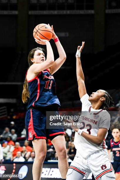 Helena Pueyo of the University of Arizona Wildcats goes up for a jumpshot over Honesty Scott-Grayson of the Auburn University Tigers during the First...