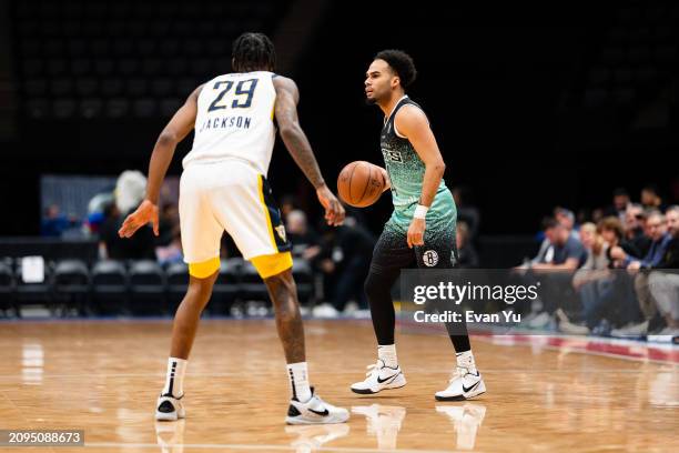 Jacob Gilyard of the Long Island Nets handles the ball against the Indiana Mad Ants on March 21, 2024 at Nassau Coliseum in Uniondale, New York. NOTE...