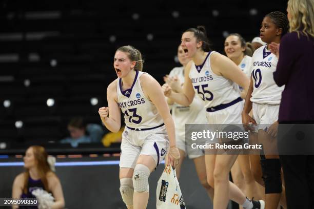 Members of the Holy Cross Crusaders women's basketball team react after a basket in the third quarter against the UT Martin Skyhawks during the First...