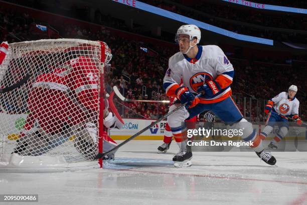 Jean-Gabriel Pageau of the New York Islanders follows the play next to James Reimer of the Detroit Red Wings during the first period at Little...