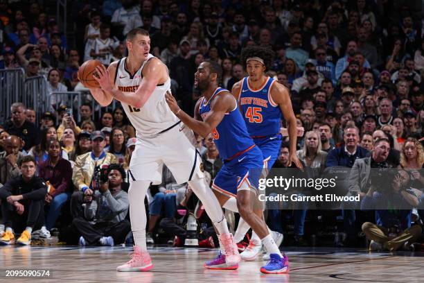 Nikola Jokic of the Denver Nuggets handles the ball during the game against the New York Knicks on March 21, 2024 at the Ball Arena in Denver,...