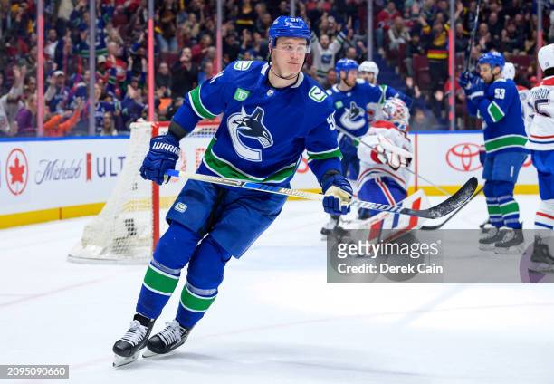 Nikita Zadorov of the Vancouver Canucks skates after scoring a goal on Sam Montembeault of the Montréal Canadiens during the first period of their...