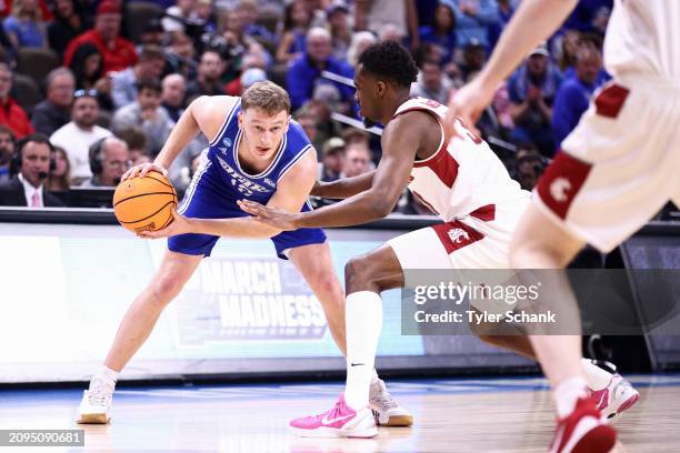 Tucker DeVries of the Drake Bulldogs looks for an opeing in the first half of the game against the Washington State Cougars during the first round of...