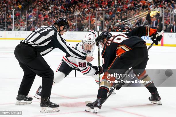 1st draft pick Connor Bedard of the Chicago Blackhawks and 2nd draft pick Leo Carlsson of the Anaheim Ducks get ready for the puck drop during the...