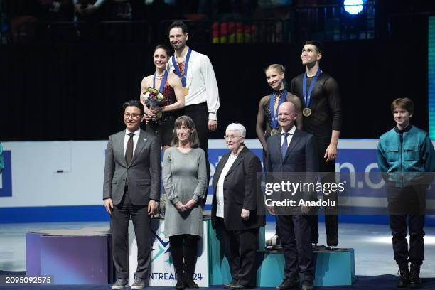 Gold medalists Deanna Stellato-Dudek and Maxime Deschamps of Canada pose on the podium with bronze medalist Minerva Fabienne Hase and Nikita Volodin...