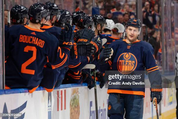 Zach Hyman of the Edmonton Oilers celebrates his second goal of the game in third-period against the Buffalo Sabres with his teammates at the bench...