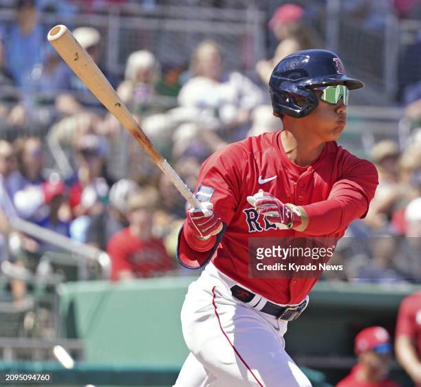 Masataka Yoshida of the Boston Red Sox flies out in the sixth inning of a spring training game against the Tampa Bay Rays in Fort Myers, Florida, on...