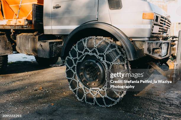 snowplow chained tire - big snow plows stock pictures, royalty-free photos & images
