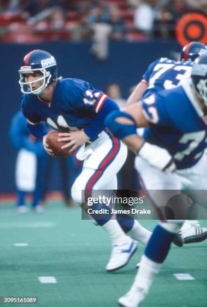 New York Giants quarterback Phil Simms drops back to pass during a regular season game against the New York Jets on November 1, 1981 at Giants...