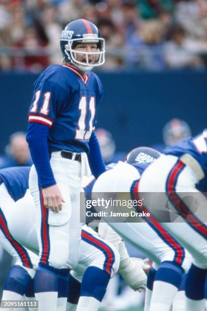 New York Giants quarterback Phil Simms calls out a play from behind center during a regular season game against the New York Jets on November 1, 1981...