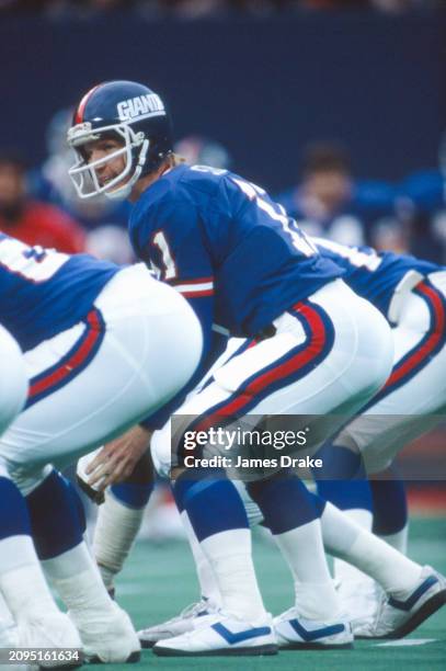 New York Giants quarterback Phil Simms calls out a play from behind center during a regular season game against the New York Jets on November 1, 1981...