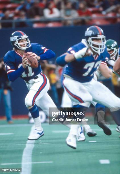 New York Giants quarterback Phil Simms drops back to pass during a regular season game against the New York Jets on November 1, 1981 at Giants...