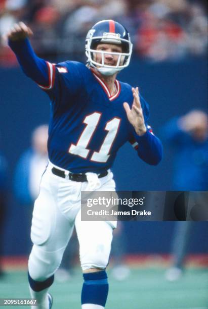 New York Giants quarterback Phil Simms throws a pass during a regular season game against the New York Jets on November 1, 1981 at Giants Stadium in...