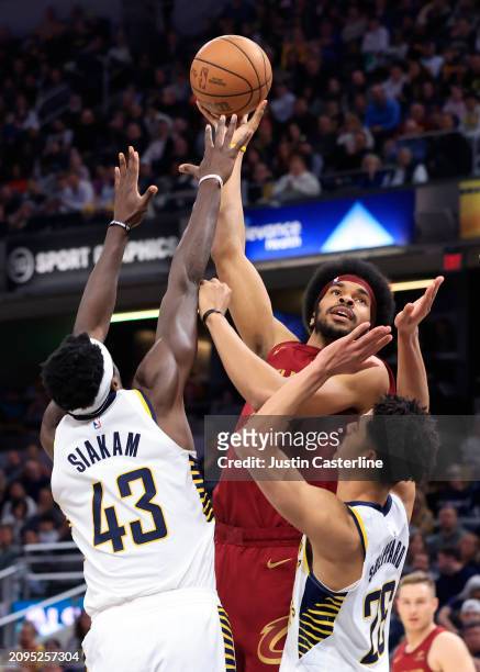 Jarrett Allen of the Cleveland Cavaliers shoots over Pascal Siakam and Jalen Smith of the Indiana Pacers during the first half at Gainbridge...