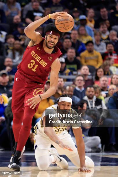 Jarrett Allen of the Cleveland Cavaliers takes control of the ball against Myles Turner of the Indiana Pacers during the first half at Gainbridge...